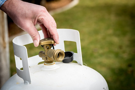 A propane tank on the grass