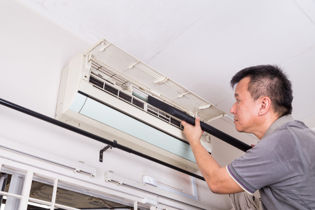 A Man Working on a Ductless Unit