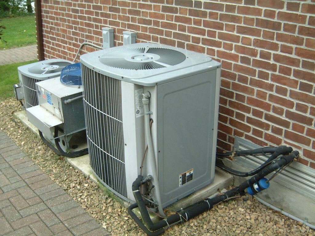 An Air Conditioner Being Installed 
