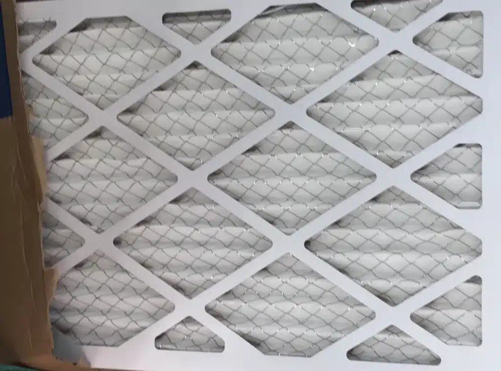 A white HVAC filter still partially in the box