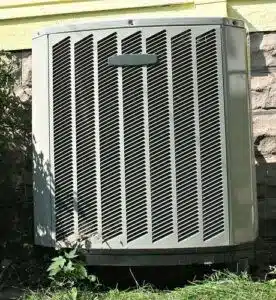 A light grey outdoor AC unit