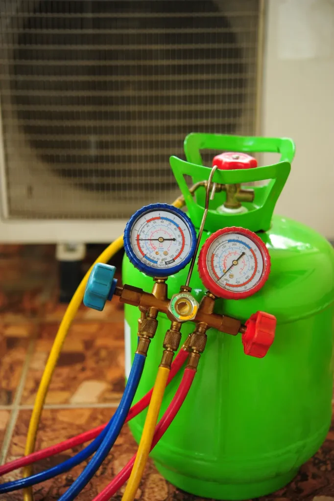 A lime green refrigerant cylinder