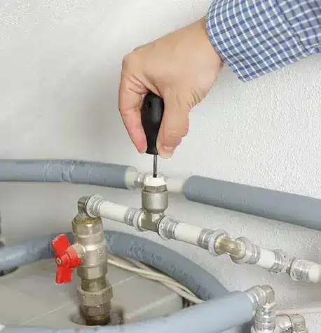 HVAC technician fixing furnace