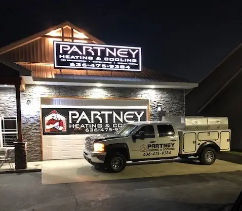 Partney Heating and Cooling building with truck